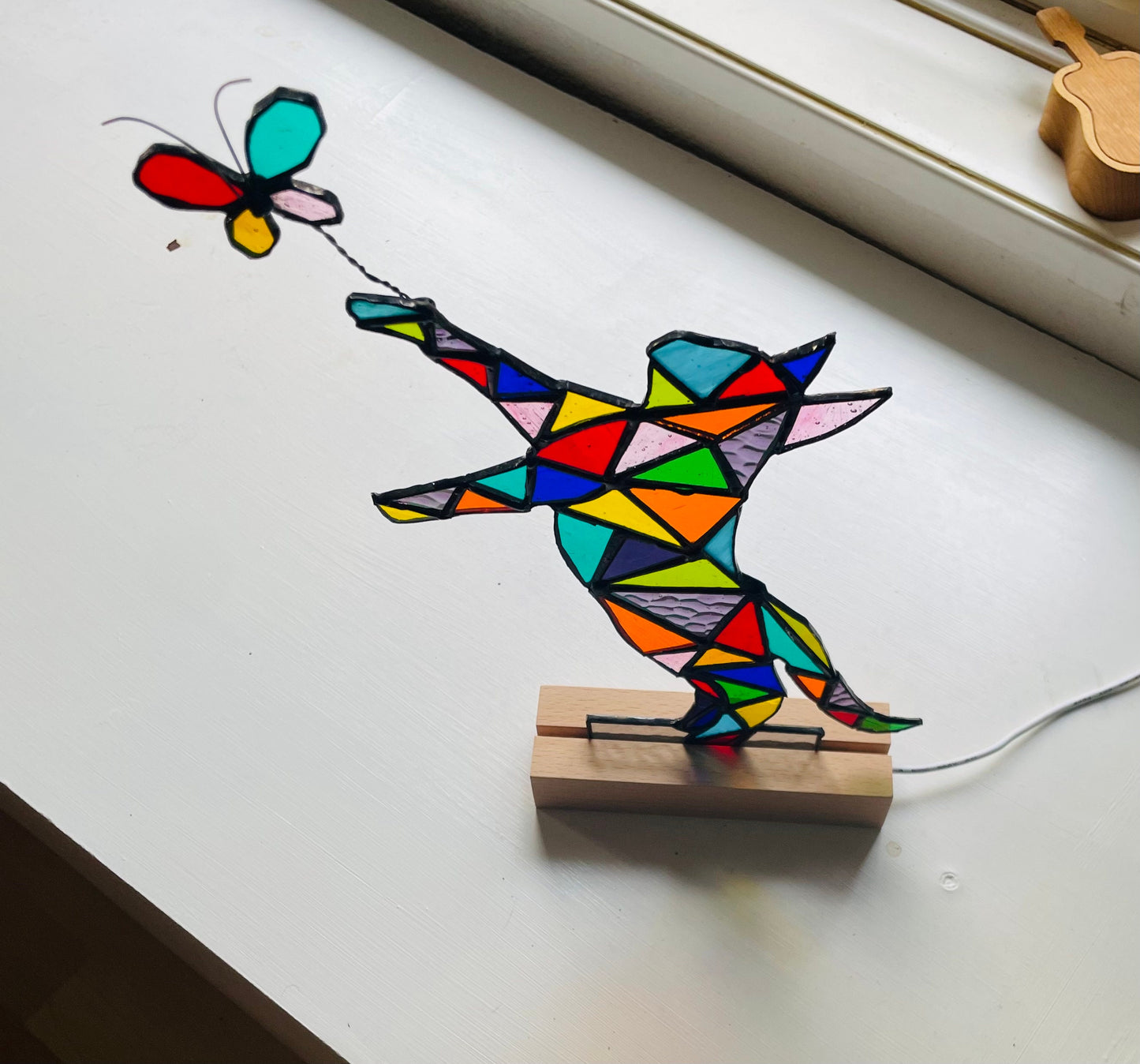 Stained glass cat chasing a butterfly with light, unique colourful rainbow gift